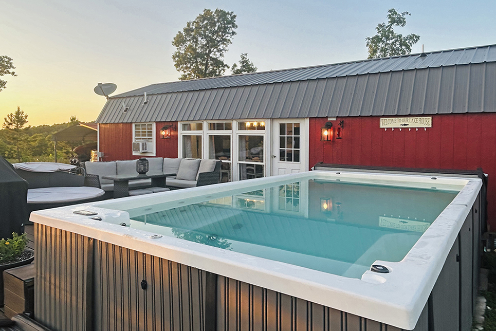 Coco's cabin's largest size: 16 x 52. Showing Buffalo Pools and Spa full of water at sunset